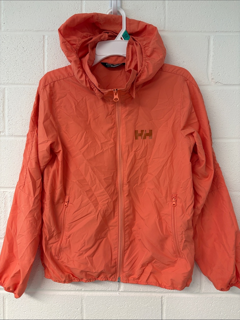 Kids Helly Hansen Coral-Orange Hooded Shell Jacket - lightweight with stuff sack